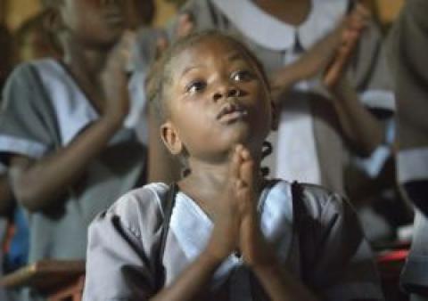 A student prays at the John Paul II School in Wau, South Sudan