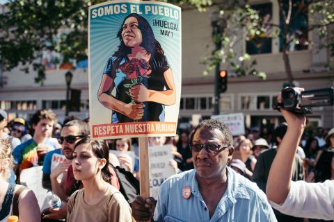 "We are the people" "Respect our humanity" poster at May Day Rally in Oakland, CA, 2017