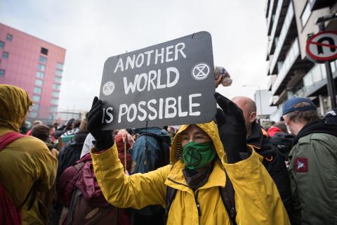 Another world is possible sign at protest on final day of COP26 Nov. 12. 2021 by LWF/Albin Hillert
