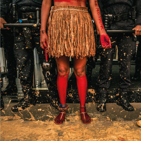 Indigenous Protester Against Police Backdrop