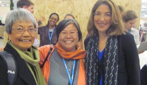 Maryknoll Sisters Becky Macugay and Marvie Misolas with Naomi Klein