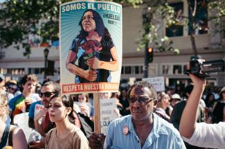 "We are the people" "Respect our humanity" poster at May Day Rally in Oakland, CA, 2017