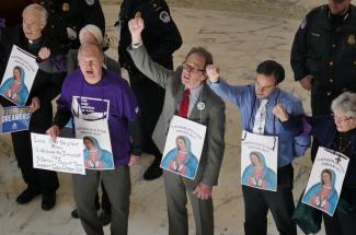 Gerry Lee, center with red tie