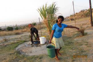 Sr. Claris’ niece Tafadzwa collects water from a well in Zimbabwe.