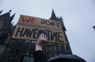 "We don't have time" sign at a Fridays for the Future climate strike. Photo available in public domain on Pixabay.